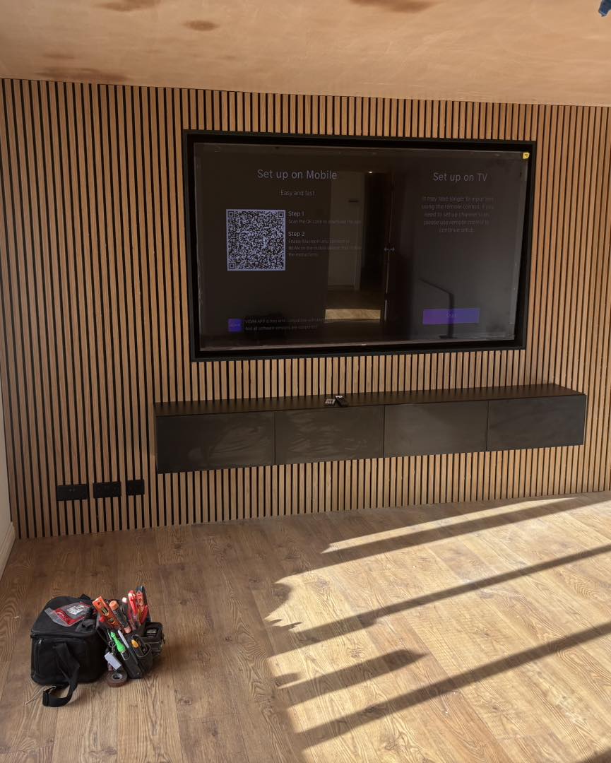 Bespoke media-wall joinery with storage and shelving